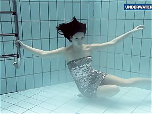 showcasing bright milk cans underwater makes everyone ultra-kinky